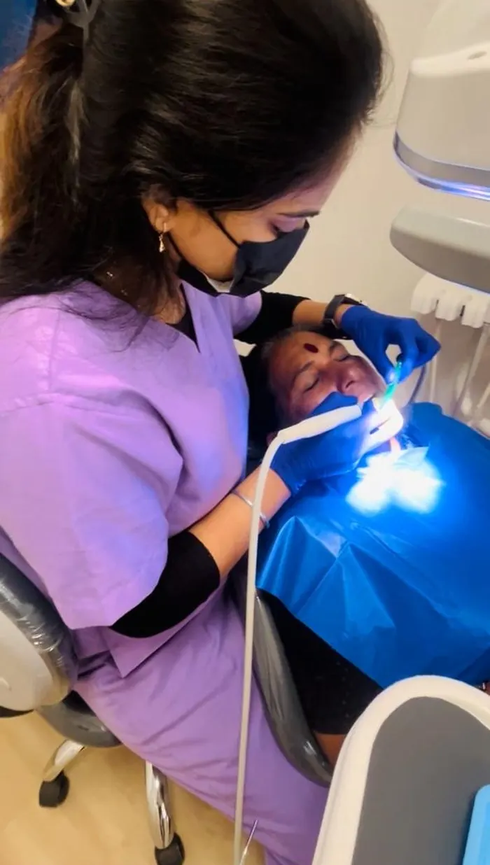 Dr. Pooja Biradar-Motagi performing a dental procedure at Ekdant Dental Clinic